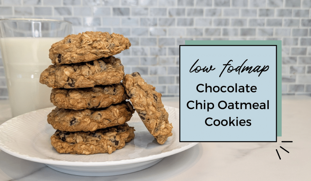 Stack of low fodmap chocolate chip oatmeal cookies with glass of milk in the background