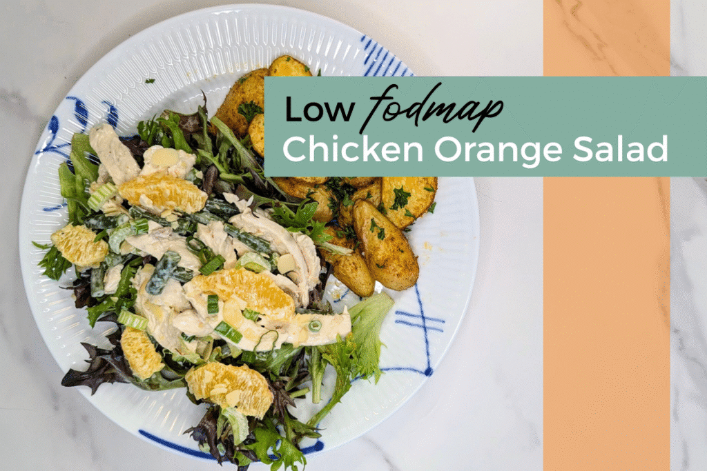 Plate containing low fodmap chicken orange salad with roasted fingerling potatoes